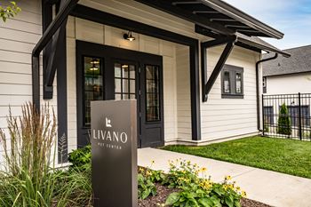 the entrance to a building with a sign in front of it